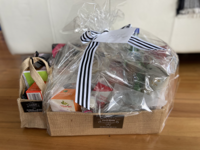 Gift hamper - A beautiful gift hamper filled with healthy treats, including healthy drinks, nuts, dried fruit, vegetable chips, dark chocolate, bliss balls, crackers and cheese.