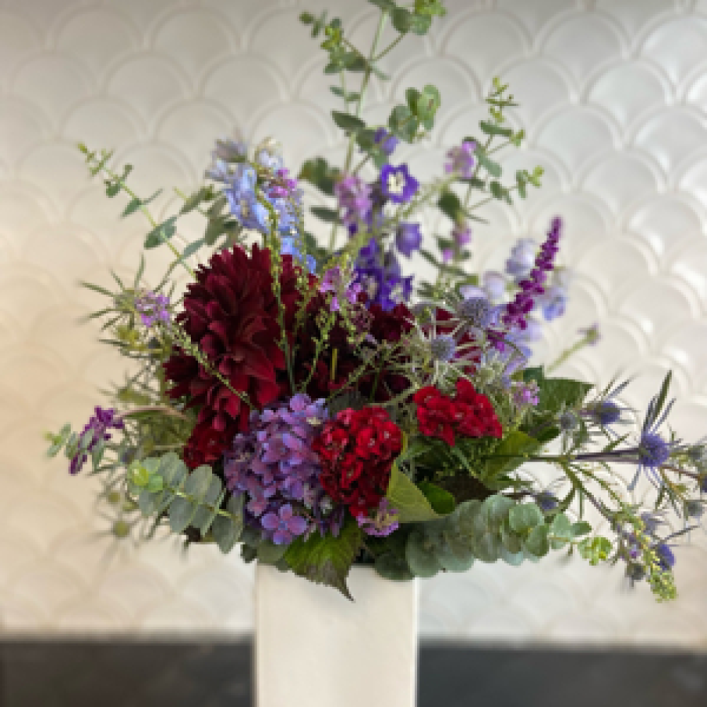 Red and blue hues in a vase Product Image