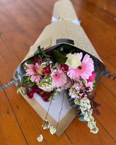 Gerbera and Rose bouquet - A gorgeous bouquet with gerberas, roses and some other lovely fillers, roll wrapped in environmentally friendly brown paper) with a little bit of prettiness thrown in to make it just the most gorgeous thing ever!